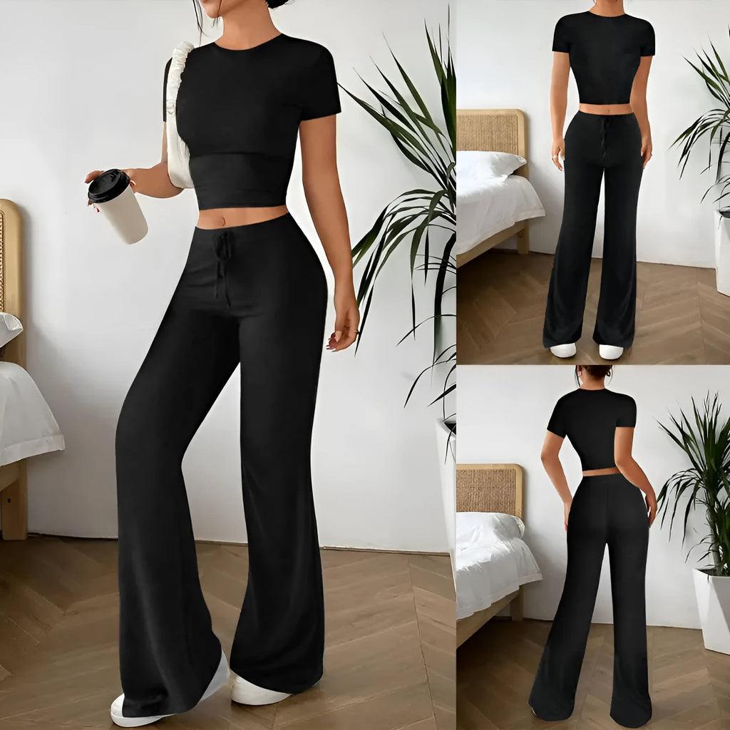 Black women's co-ord set with high waist trousers and regular sleeve T-shirt laid flat