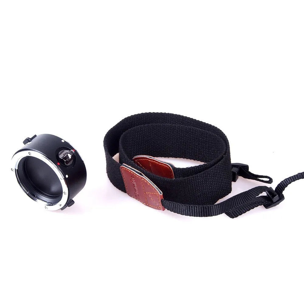 Aluminium alloy Nikon E-Mount lens flipper with stainless steel buckle and cotton shoulder strap.