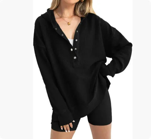 Women's loose fit peacock green raglan sleeve pullover sweater on a hanger.