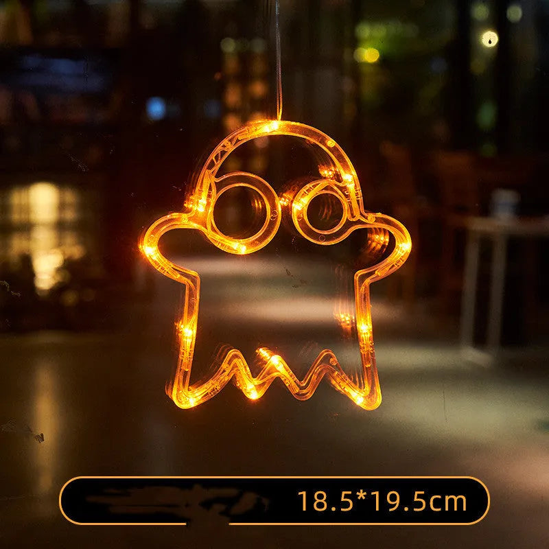 Set of seven Halloween-themed LED hanging lights with suction cups for window display