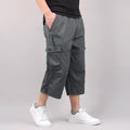 Man wearing loose khaki cotton cropped casual pants for sports.