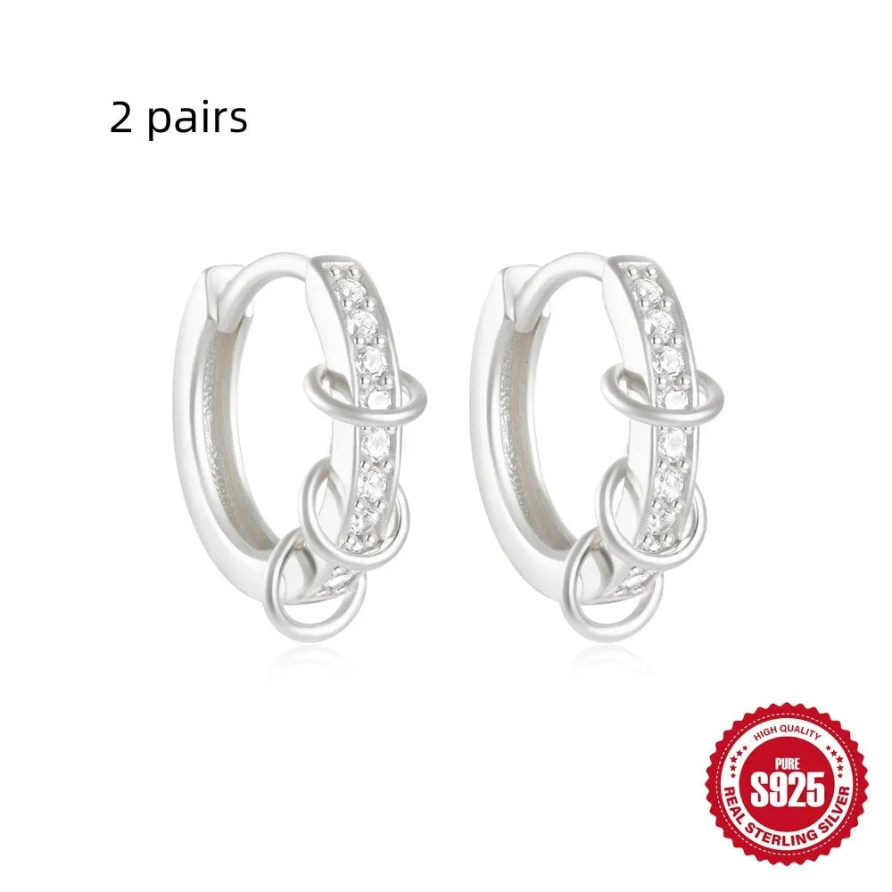 Small round geometric sterling silver stud earrings with a diamond shape, available in gold or silver finish.