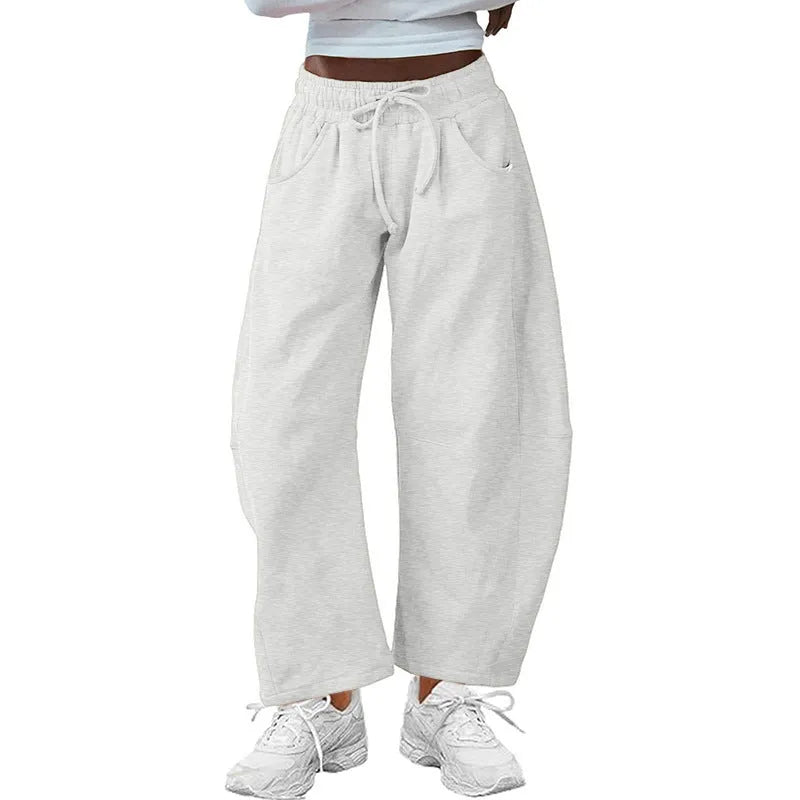 Loose cropped cotton sweatpants with elastic drawstring waist and side pockets in multiple colour options