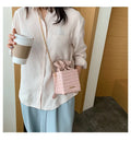 Women's small one shoulder messenger bag with chain strap in bucket style design