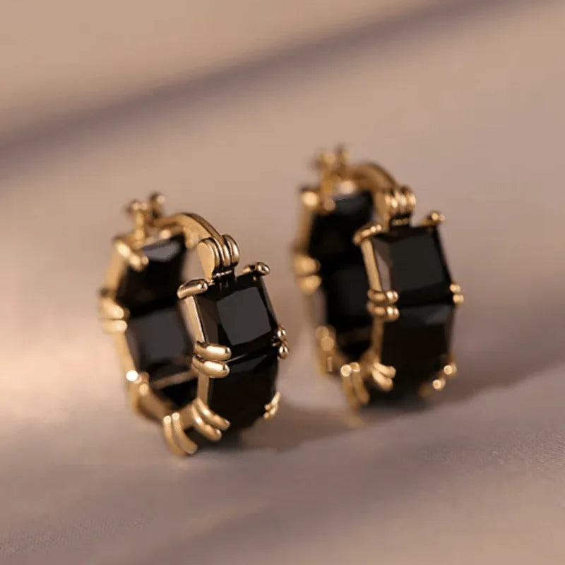 Geometric U-shaped gold ear rings with round black zircon stones