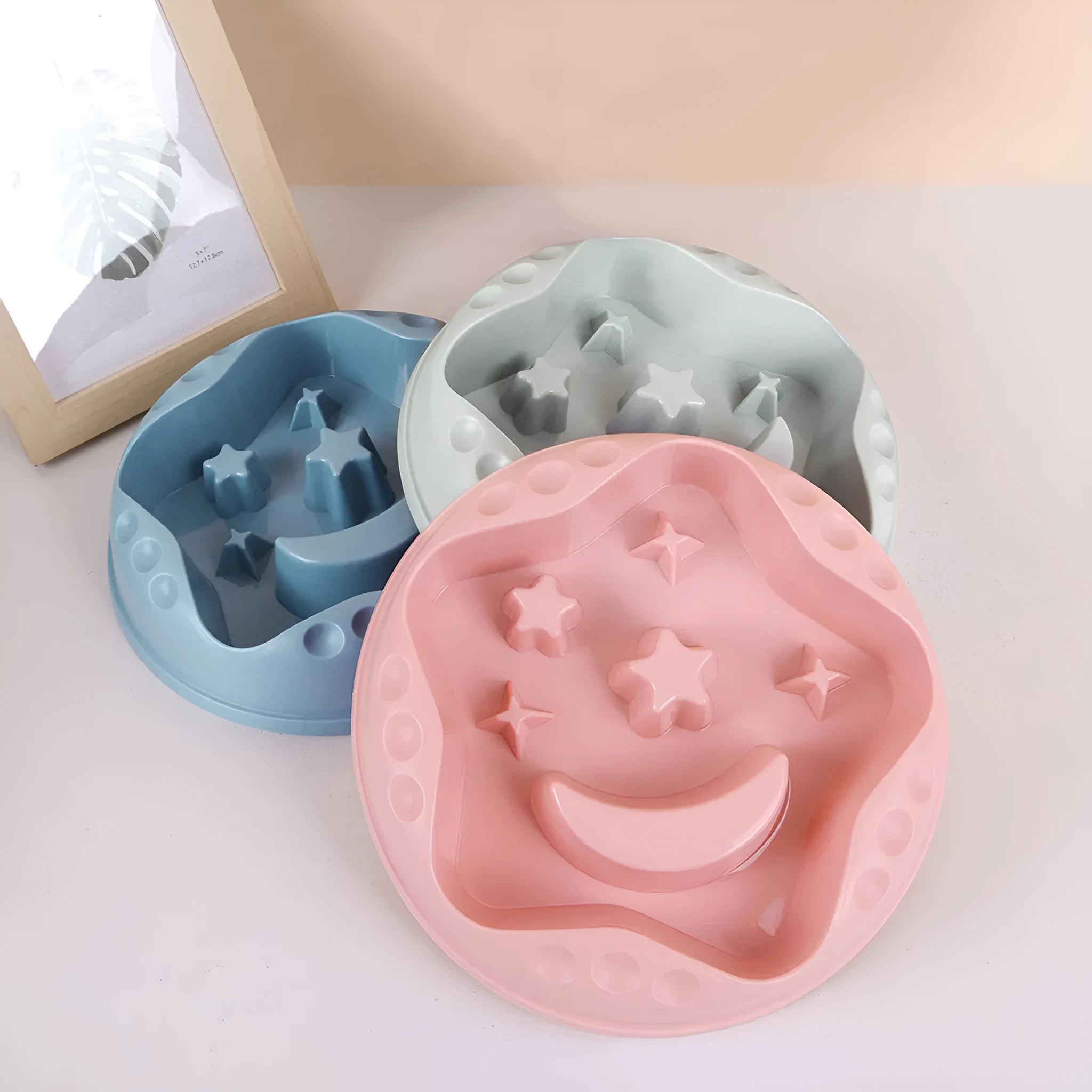 Moon Star Wings pattern slow feeder dog bowl in blue, grey, green, pink, or yellow with non-slip base