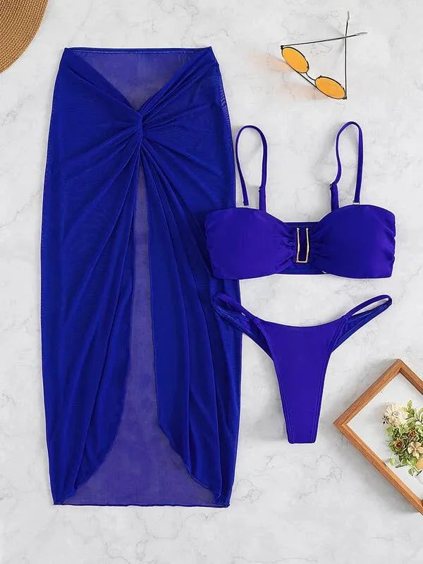 Women's multicolour French-style three-piece bikini set with a long culotte skirt on a hanger.