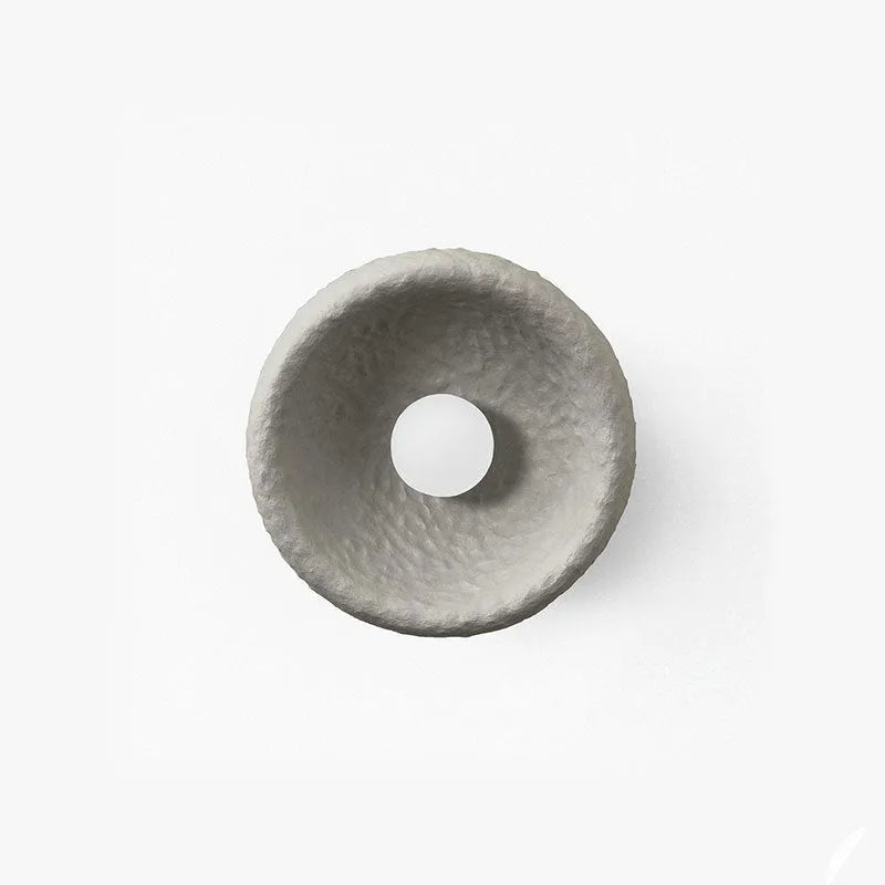Japanese-style minimalist wall lamp with resin shade in three diameter options on modern interior wall