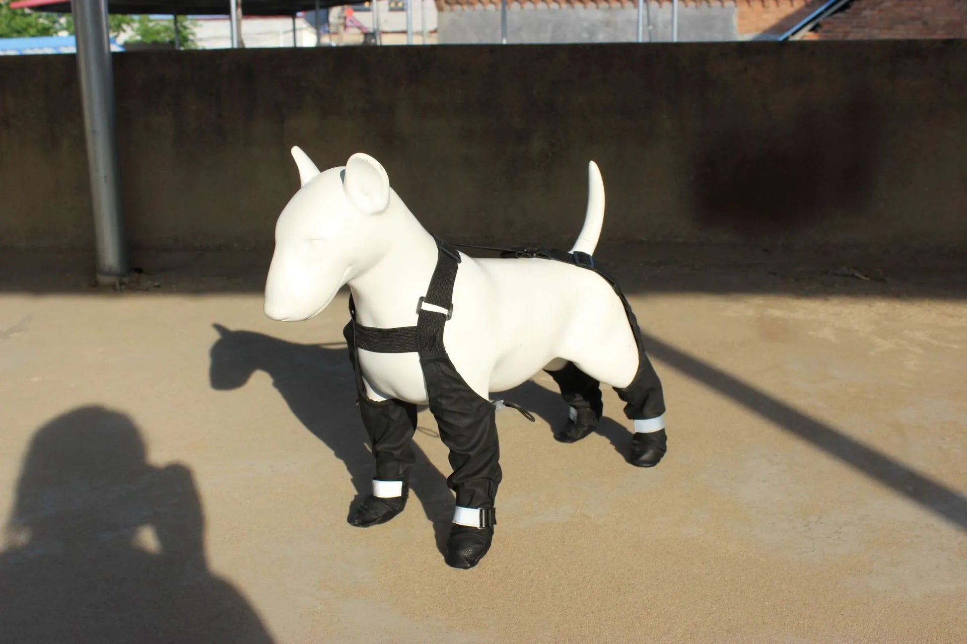 Black waterproof dog shoes with non-slip soles and strap fastening system