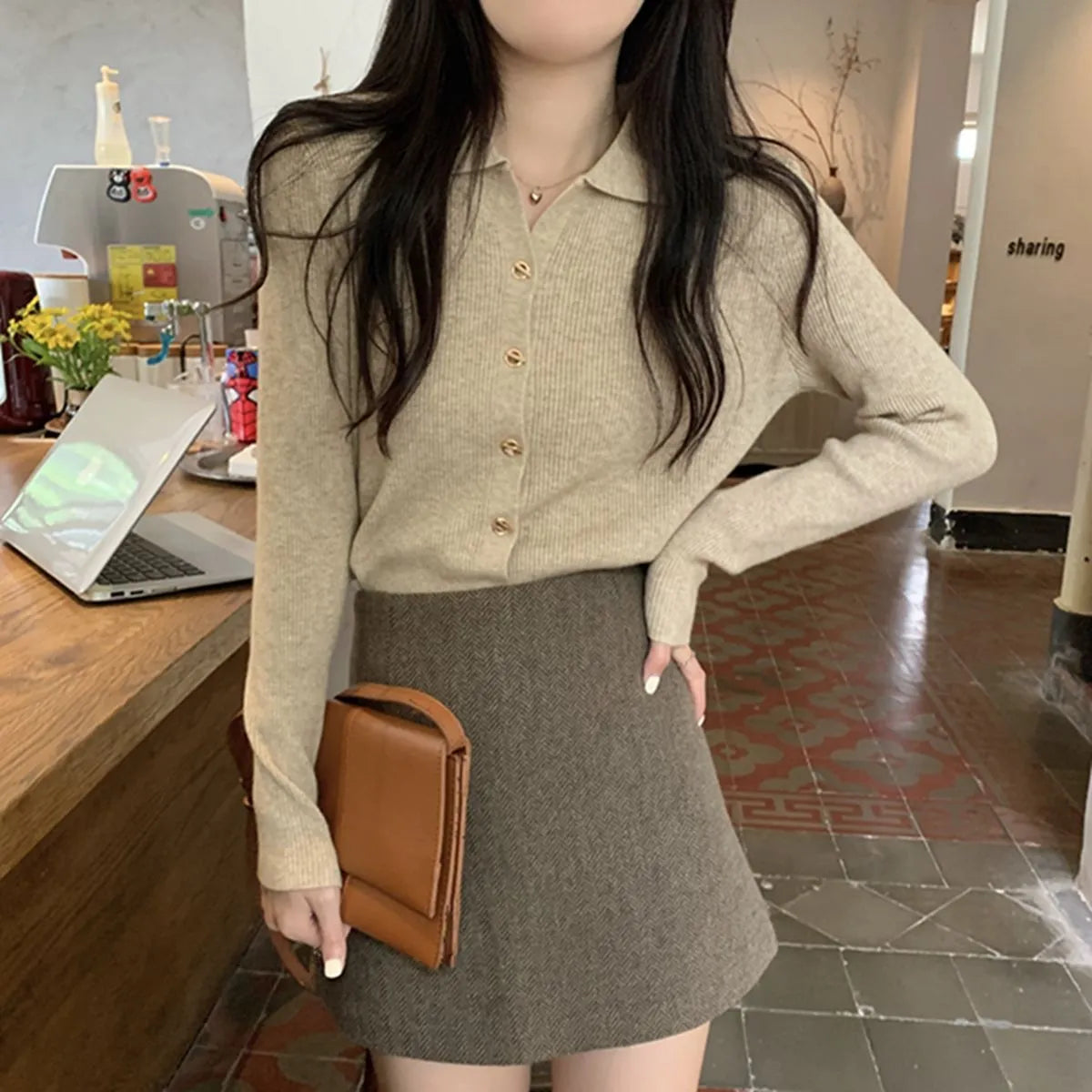 Loose fit beige viscose knitted cardigan with long sleeves, shown worn open.