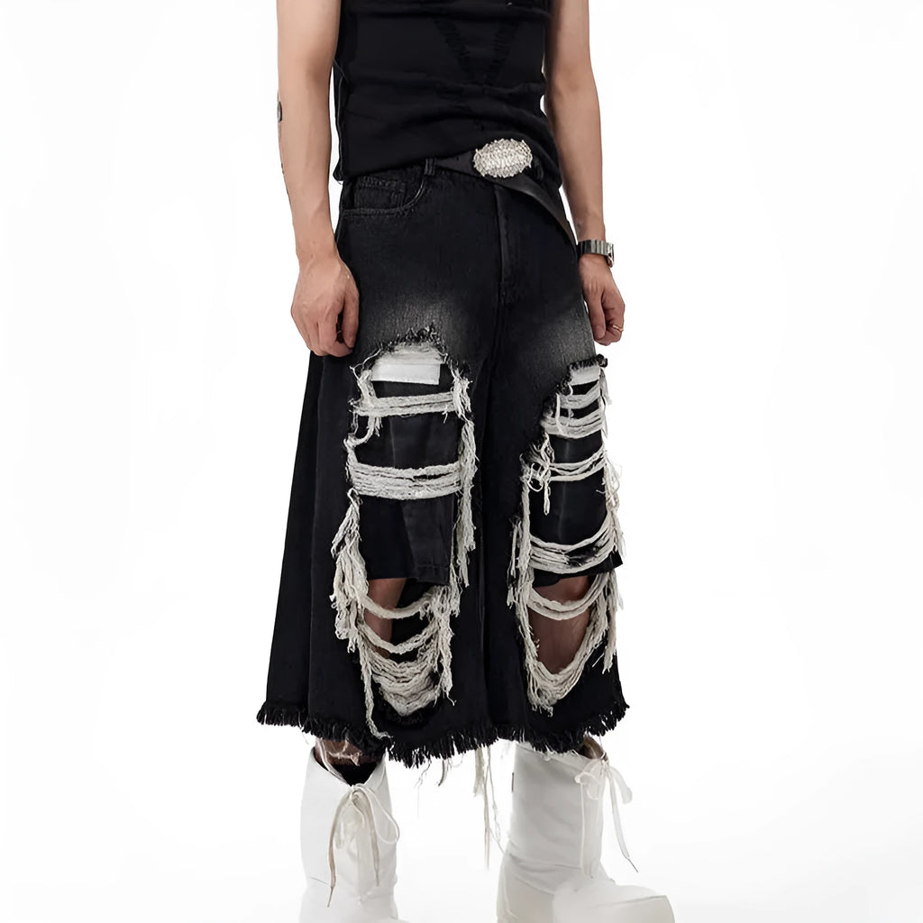 Black wide leg cropped jeans with mid-high waist and ripped patch detail on micro-elastic cotton denim
