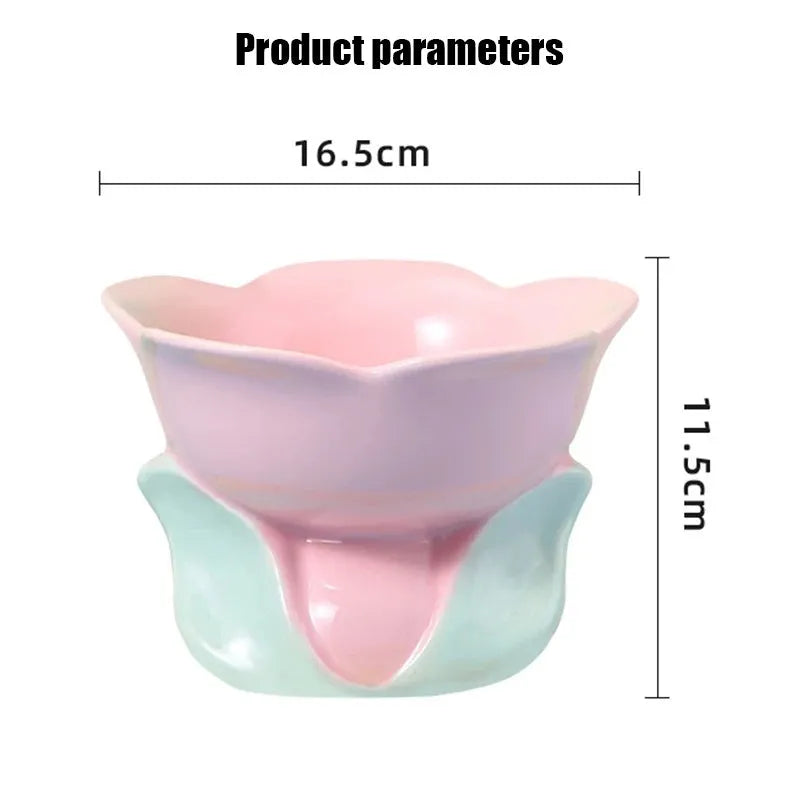 Blue ceramic elevated pet bowl with floral pattern and non-slip base for cats or small dogs.
