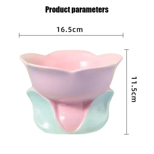 Blue ceramic elevated pet bowl with floral pattern and non-slip base for cats or small dogs.