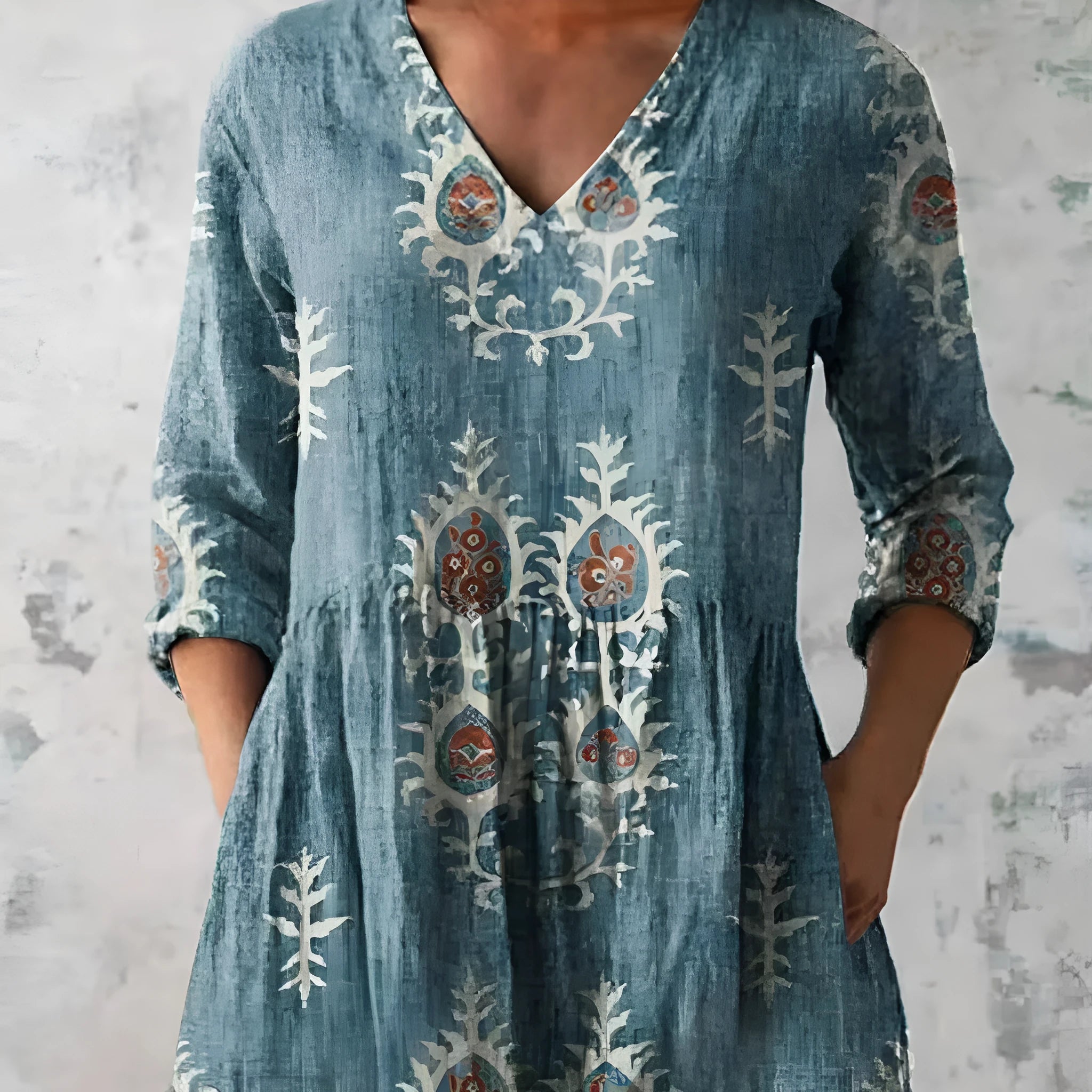 Women's printed wave pattern loose dress with wide waist and three-quarter length sleeves on a hanger.