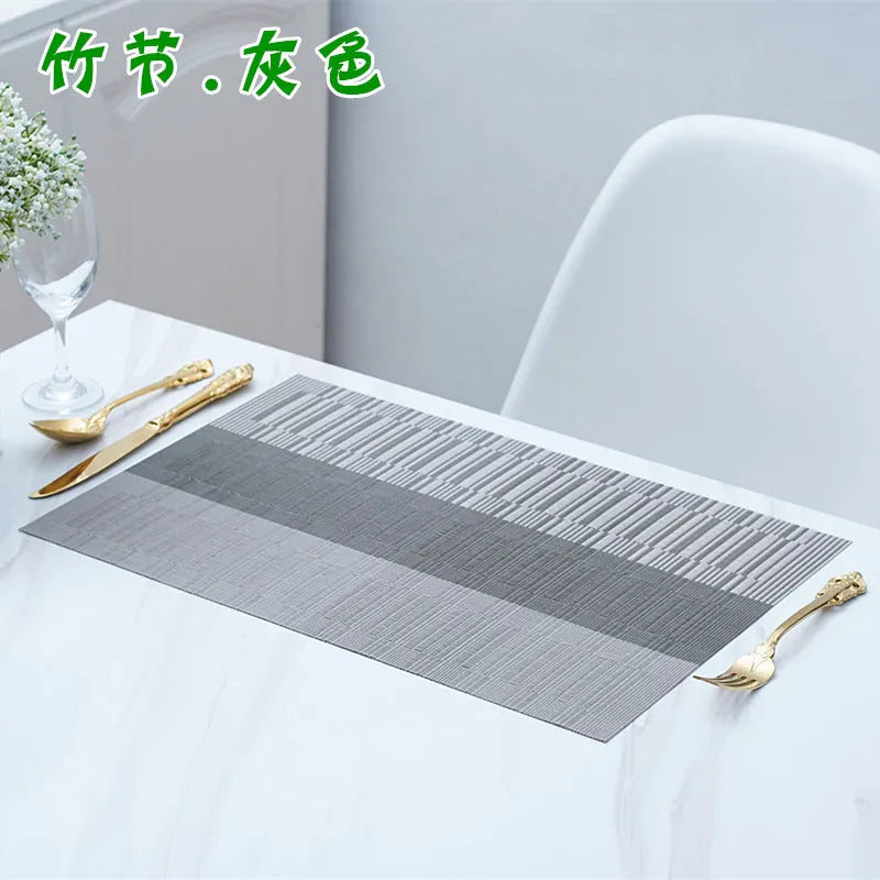 Modern PVC non-slip placemat in gradient bamboo colour on a table.