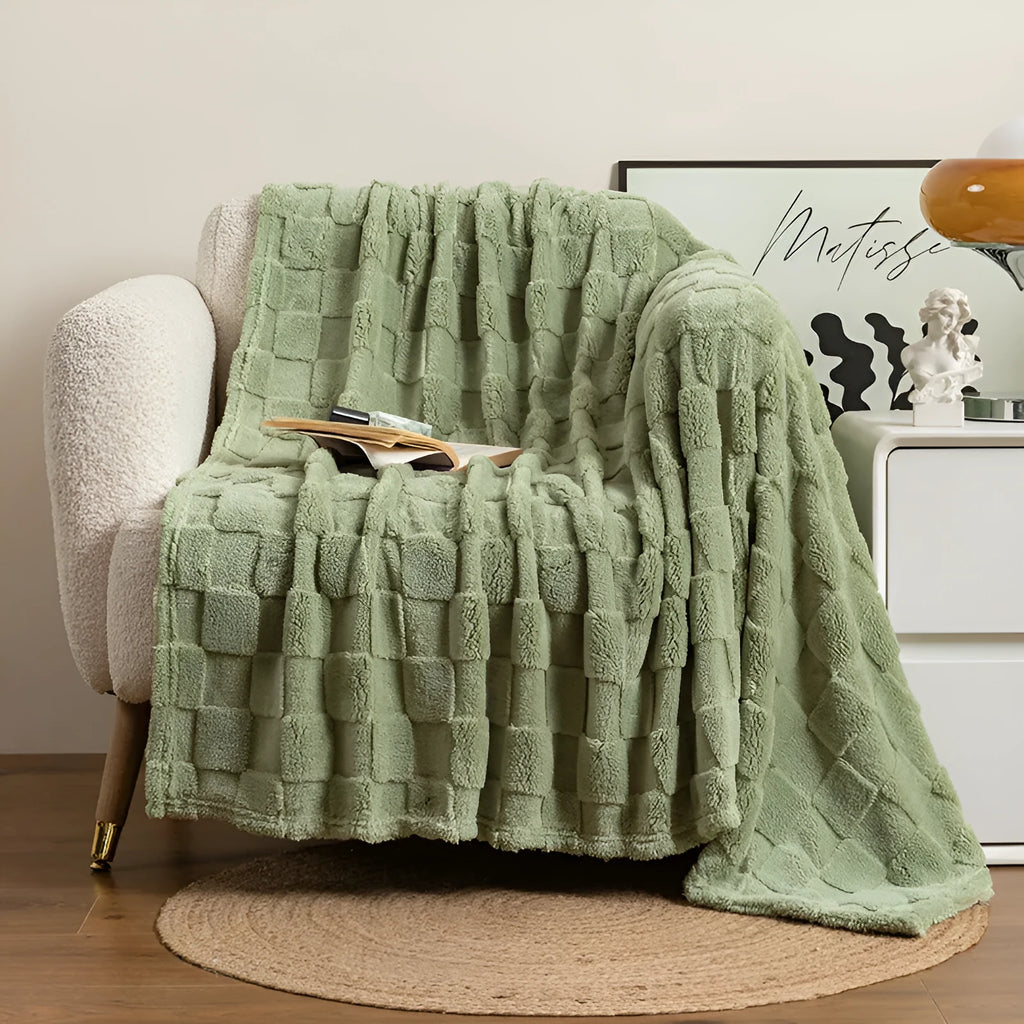 Geometric patterned polyester blanket in milky white showing cotton velvet texture and thickened construction