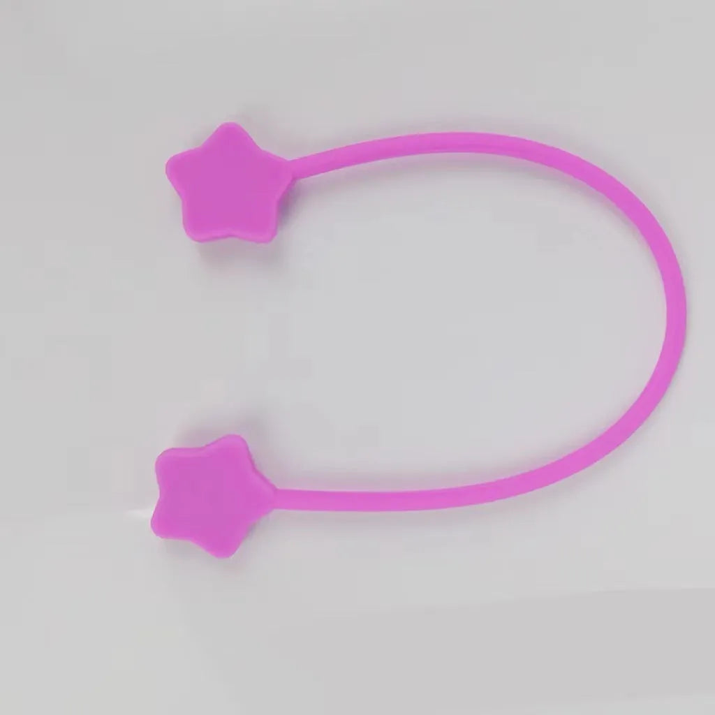 Silicone wire winder with magnet for organising cables in assorted colours on a white background.