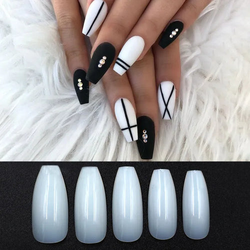 500 clear acrylic false nails in assorted sizes arranged next to application brush and bottle.