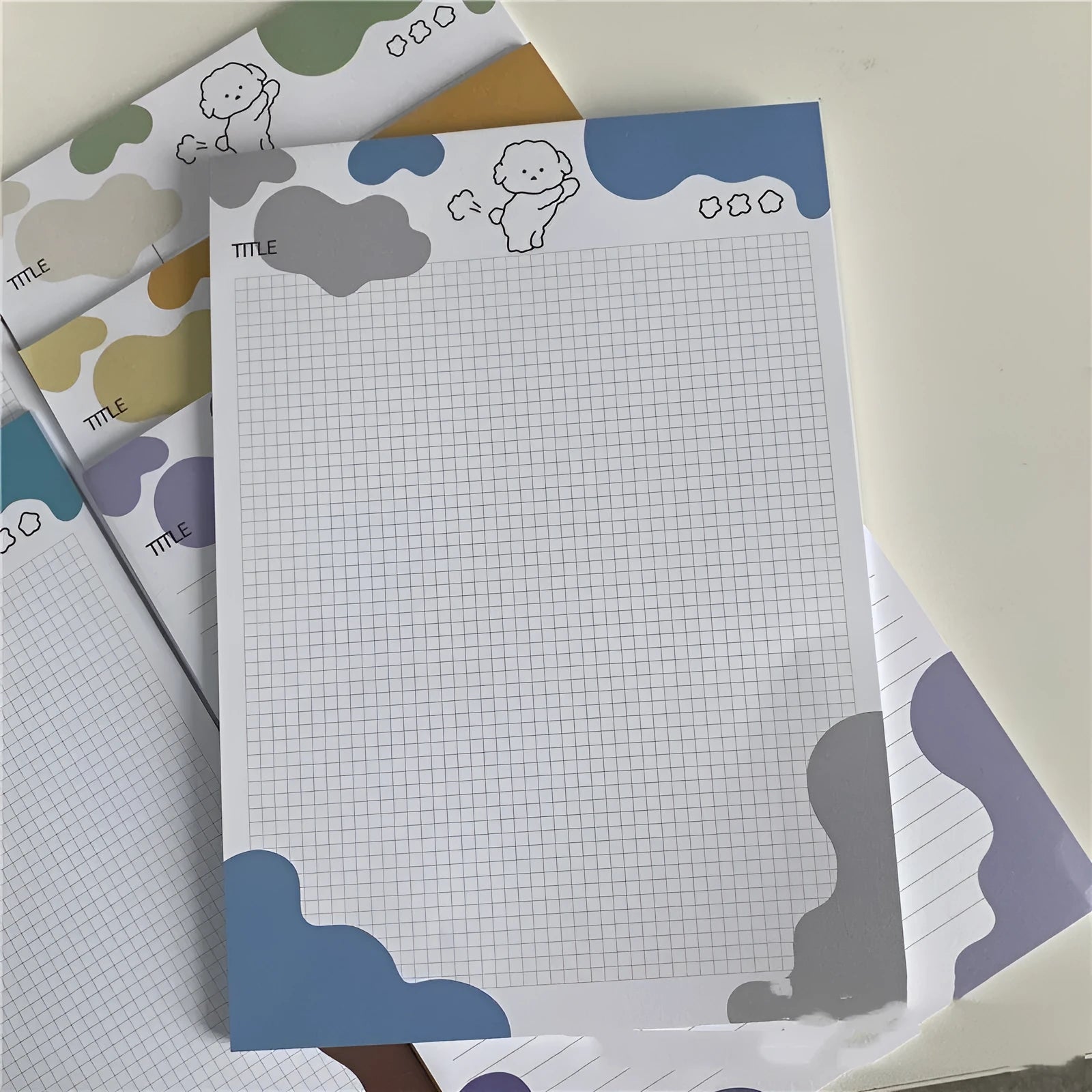 Korean marshmallow dog B5 sticky note pad with purple grey blue and orange puppy designs on paper