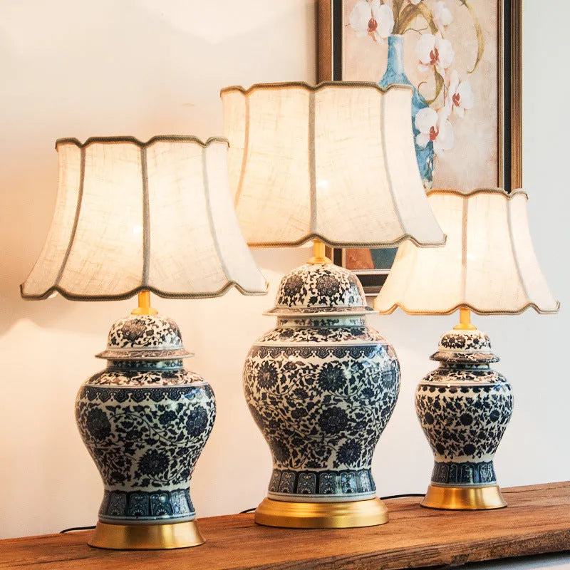 Handmade blue and white Chinese porcelain ceramic table lamp with copper base and fabric shade.