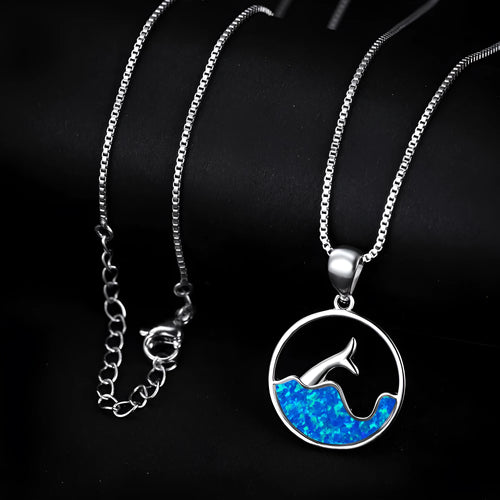 Geometric fishtail pendant necklace with a round blue opal stone on an adjustable silver-tone chain.