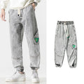 Men's cotton loose-fit tapered trousers in black, blue, or grey colours with mid-waist design
