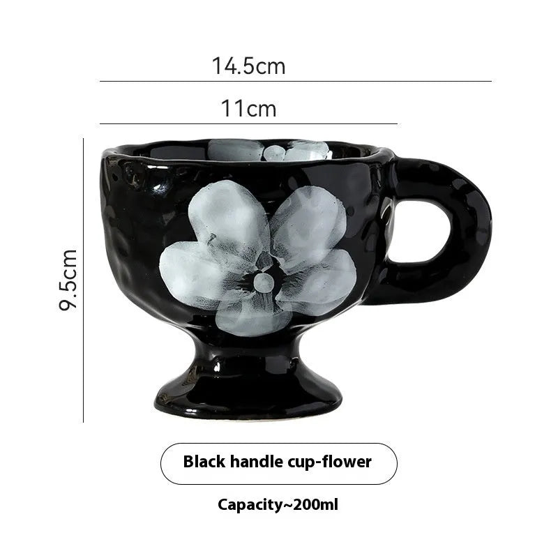Hand-pinched irregular ceramic mug in a solid colour, showing unique handmade shape.