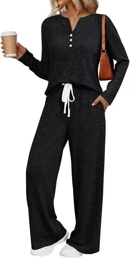 Women's striped knit V-neck long coat in light grey with matching pants, showing lace-up details