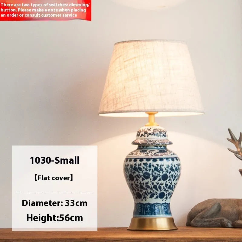 Handmade blue and white Chinese porcelain ceramic table lamp with copper base and fabric shade.