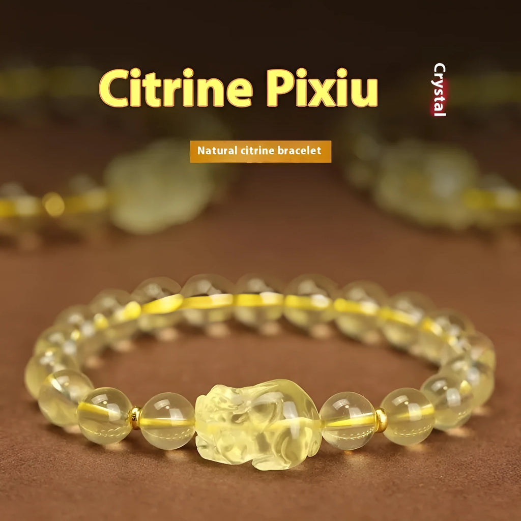Yellow leather cord bracelet with an artificial citrine crystal Pi Xiu charm and beads.