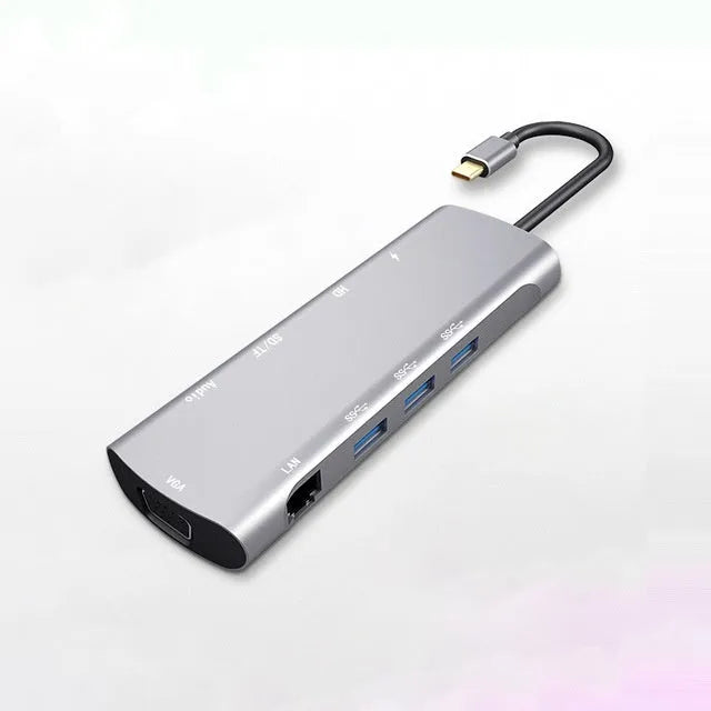 Grey USB-C docking station with HDMI, VGA, USB 3.0 and charging ports