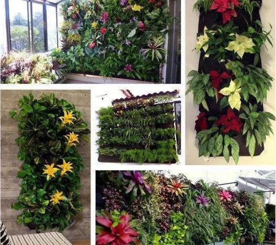 Green recycled felt vertical wall planter with multiple planting pockets hung on a wooden fence.