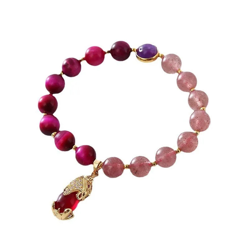 Strawberry crystal elastic bracelet for women on a white background.
