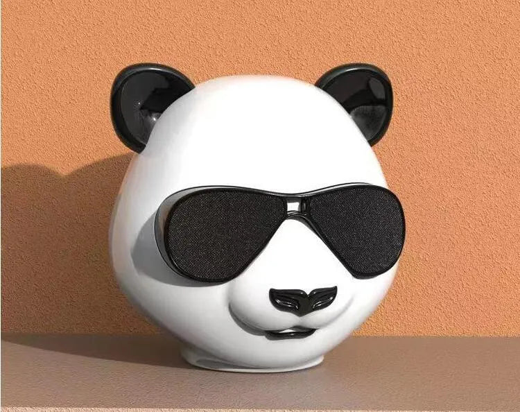 Portable mini classic style Bluetooth speaker showing USB charging port.
