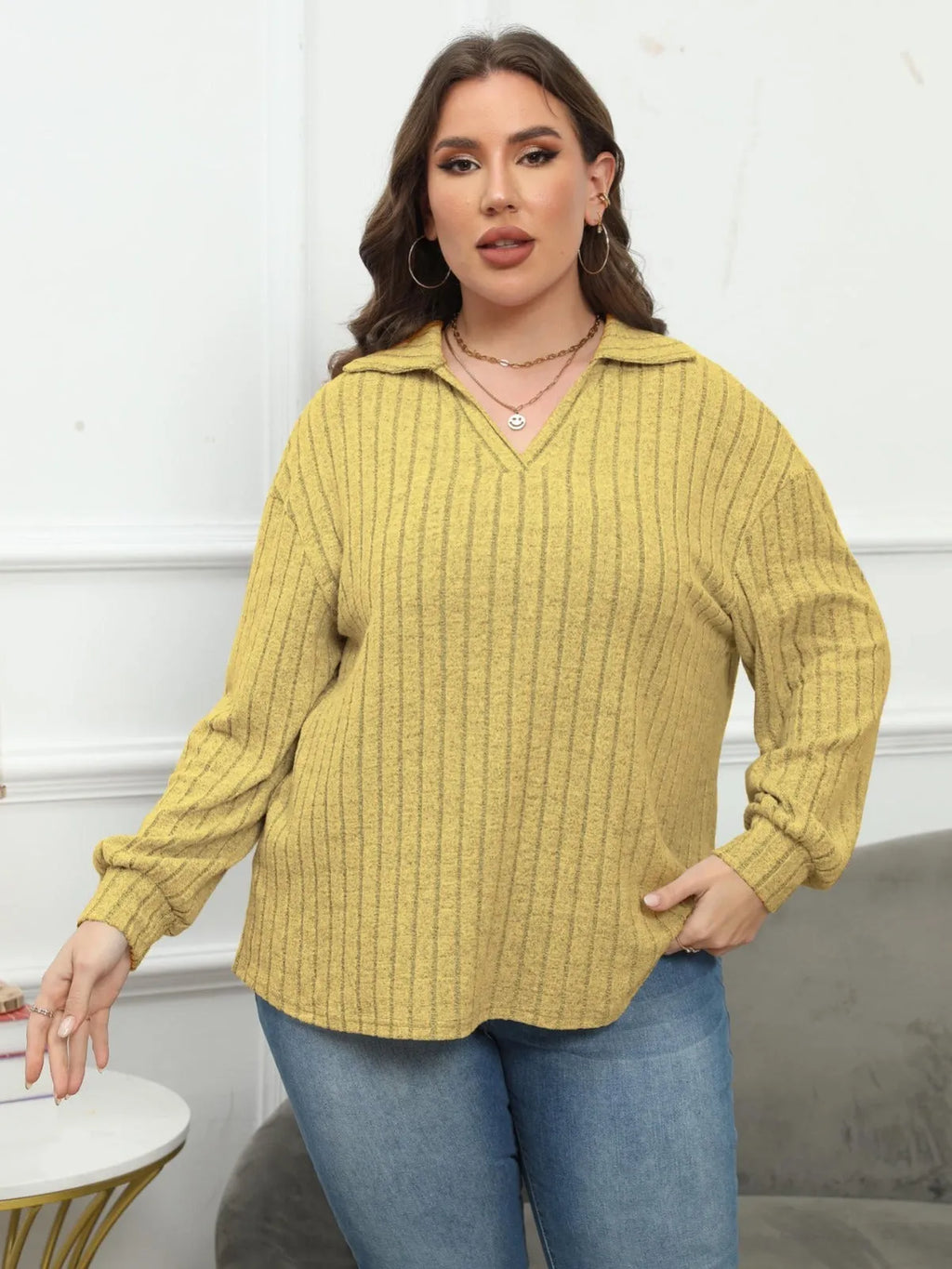 Women's plus size grey polo collar fleece shirt with lantern sleeves on a hanger