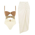 Women's solid colour one-piece swimsuit with a detachable skirt in assorted colours.