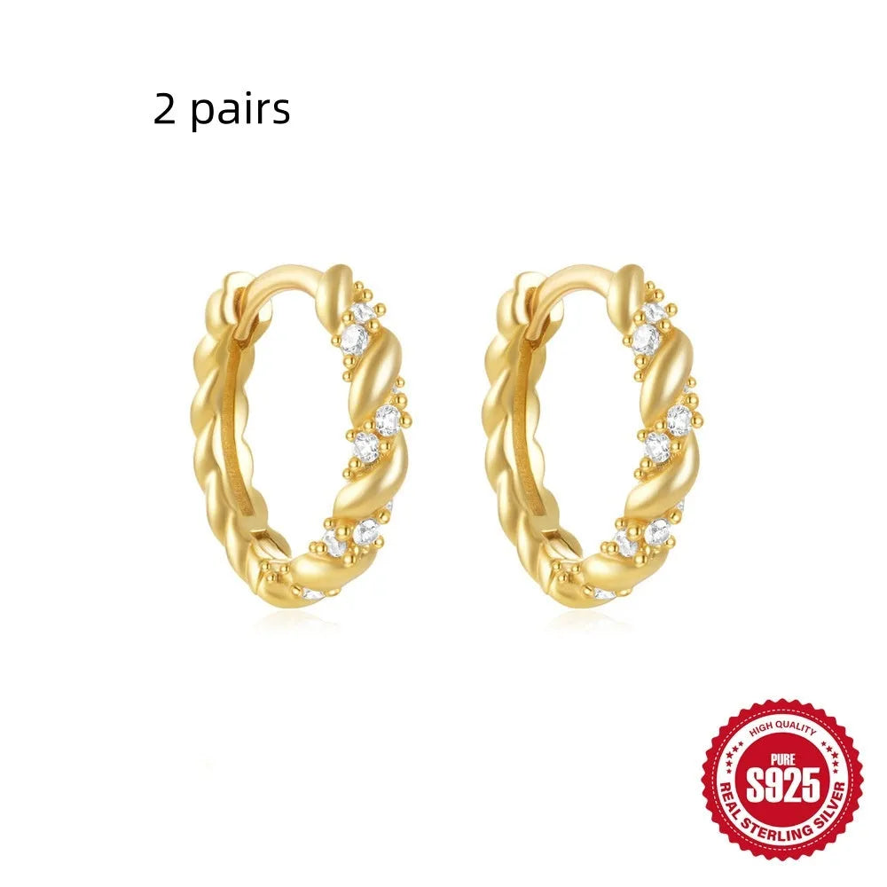 Small round geometric sterling silver stud earrings with a diamond shape, available in gold or silver finish.