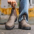 Unisex vintage brown Chelsea boots with a chunky sole and round toe on a white background