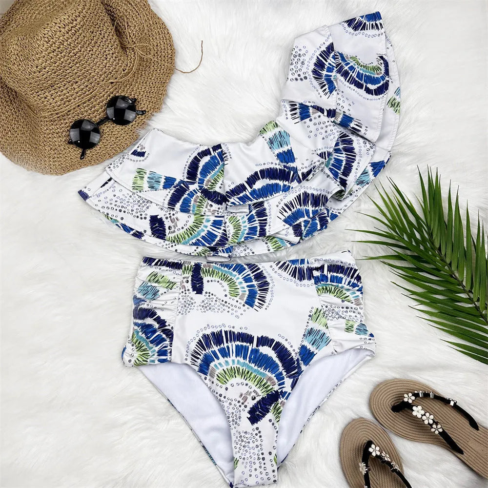 White women's one-shoulder swimsuit with lotus leaf detail and split design