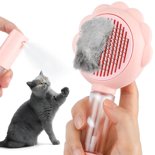 Grey spray function pet brush with stainless steel bristles and a self-cleaning button on the handle.