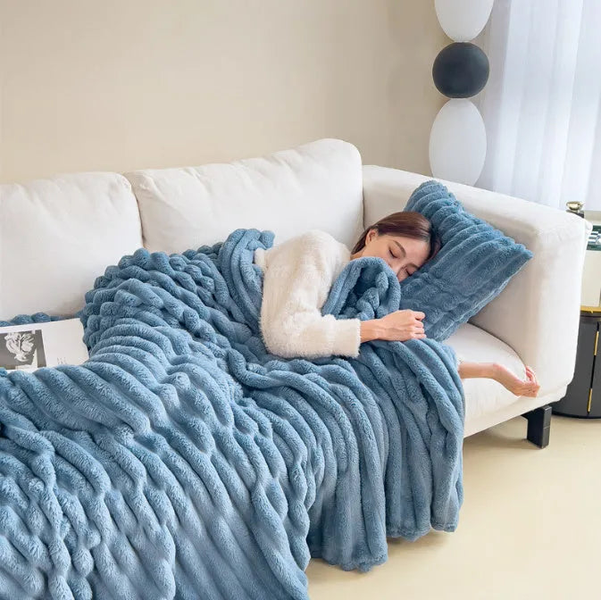 Soft Wind double-sided thickening bubble velvet blanket in a solid colour shown on a sofa.