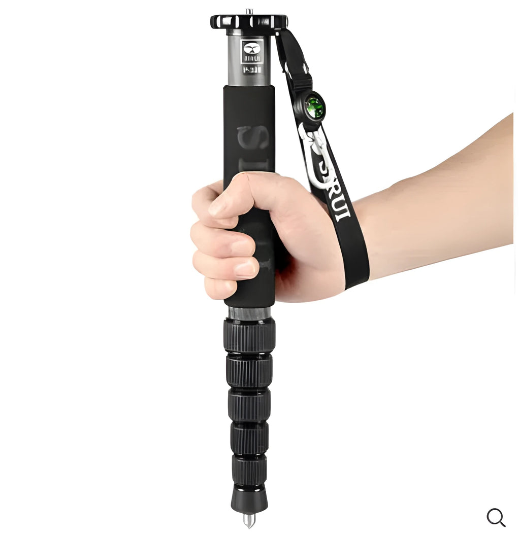 Black carbon fibre six-section telescopic camera monopod shown collapsed and extended.