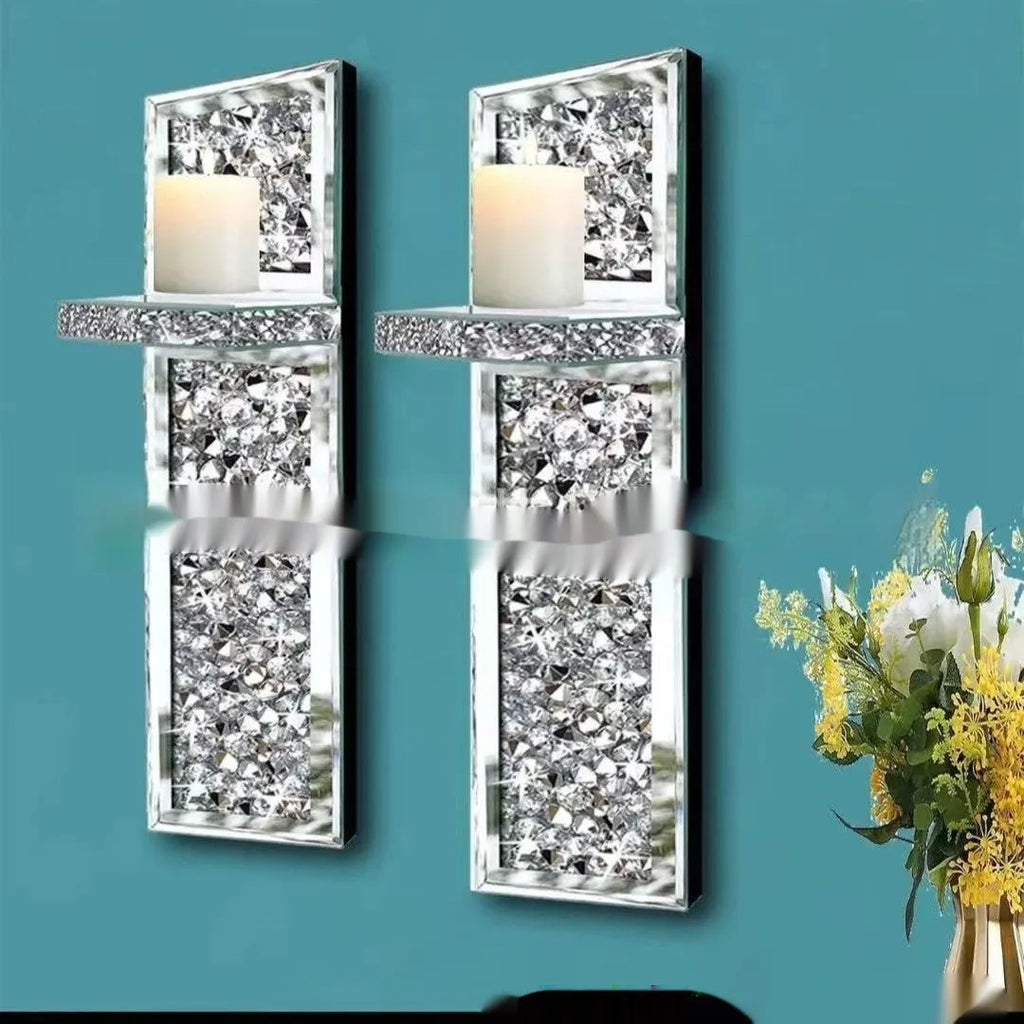 Pair of silver mirror glass wall hanging candle holders measuring 10x11x38 cm