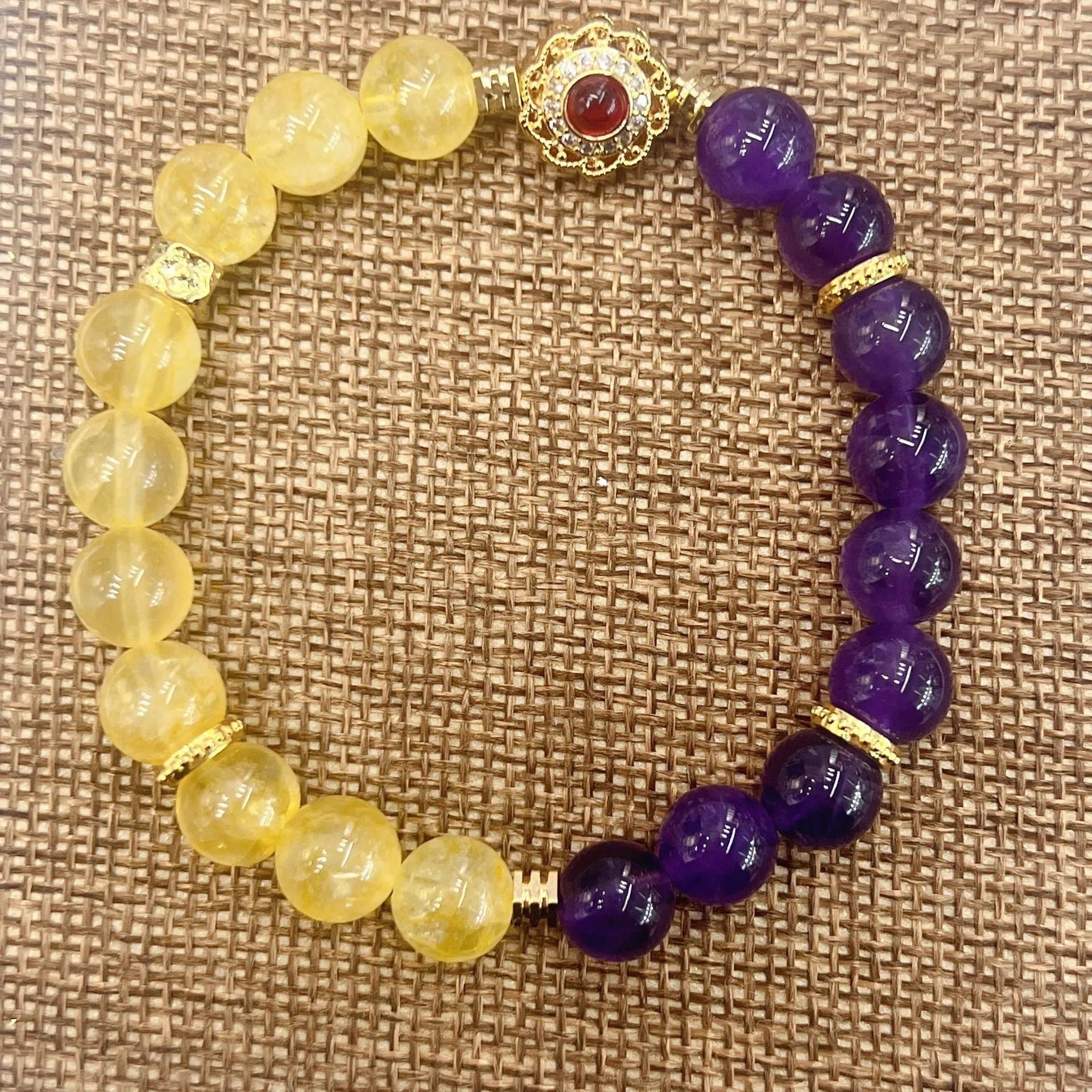 Handmade women's amethyst crystal bracelet with yellow and purple stones