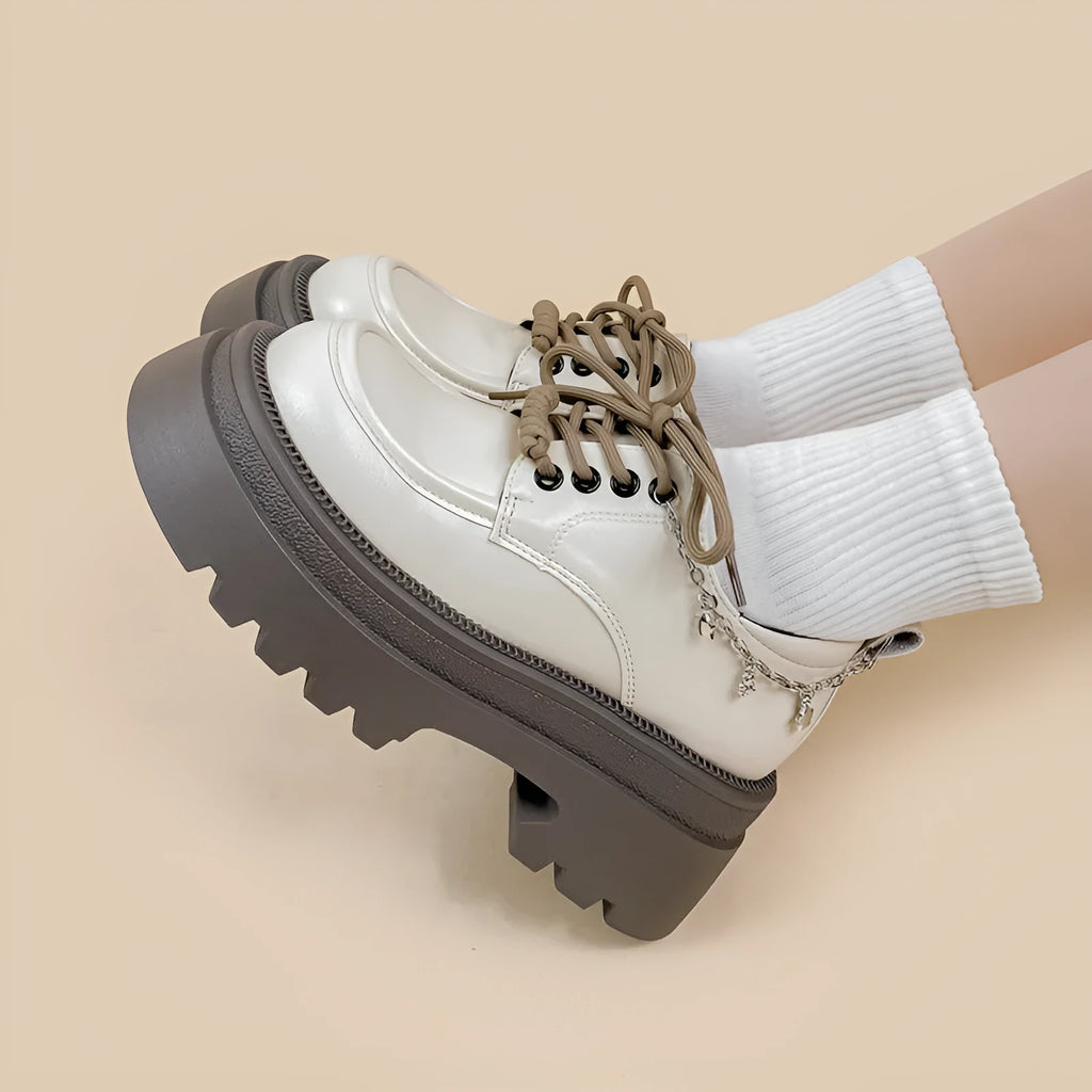 White Mary Jane platform shoes with chunky heel and front lace-up fastening