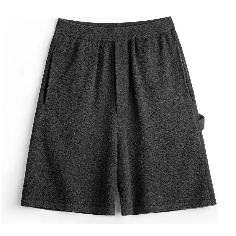 Men's cement grey straight-leg sports shorts with a loose fit, shown on a model.