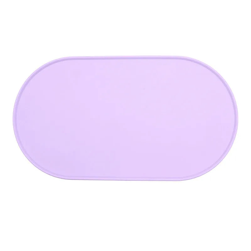 Green silicone waterproof pet feeding placemat with a food bowl on it.