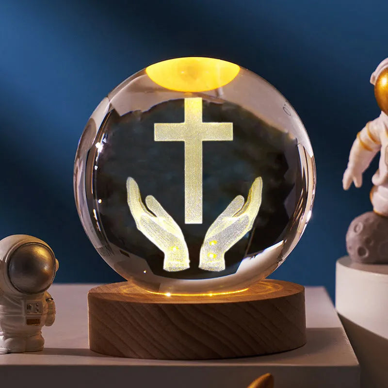 White crystal lamp with 6cm diameter orb on solid wood warm light base showing religious ornamentation