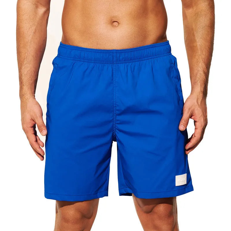 Men's quick-dry nylon sports shorts in solid colours with straight leg design