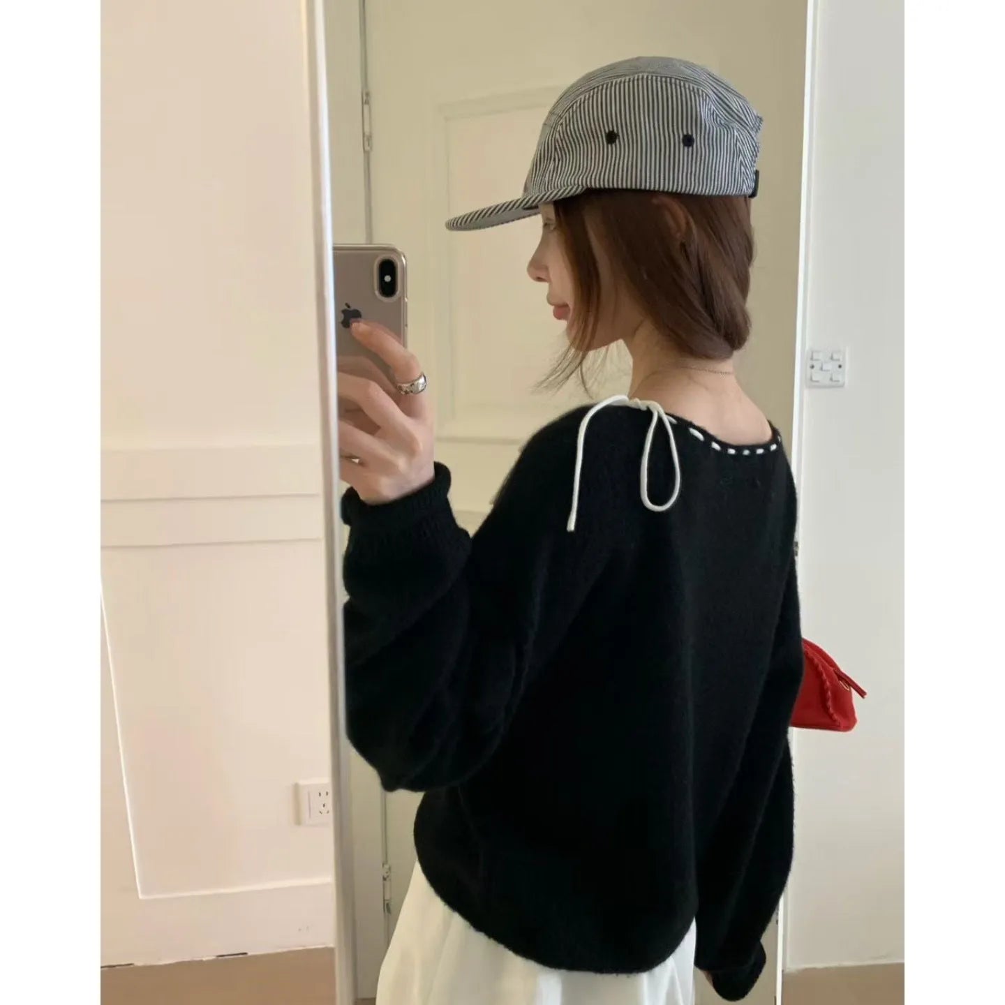 A grey loose-fitting women's knitwear pullover made from regenerated cellulose fibre.